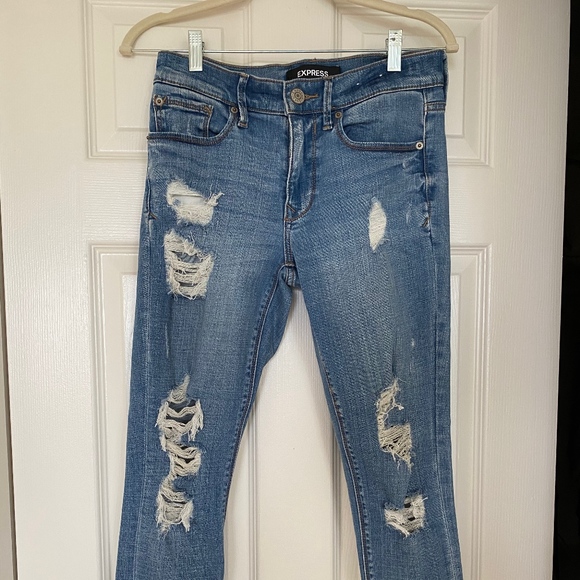 mid rise medium wash ripped ankle leggings